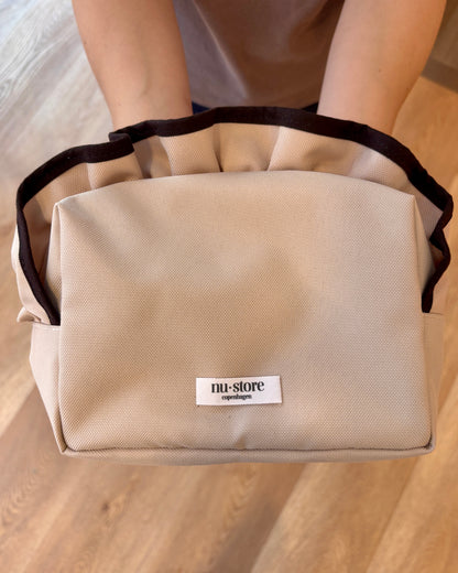Beige beauty bag med brun kant